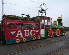 color tram on the road