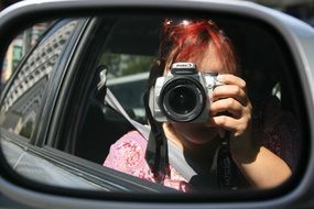 photo in the side mirror of a car