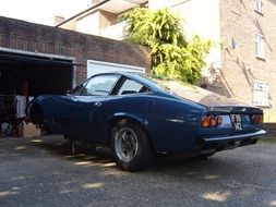 blue old classic car in garage