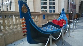 Red and blue gondola on a street in Spain