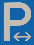 blue sign about parking