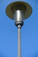 street lamp against a bright blue sky