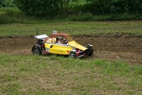 yellow racing car without top