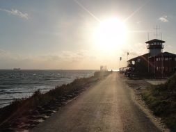 sun in the sunset over the pier