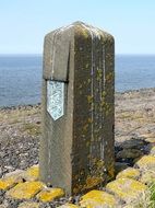 boundary stone on a sea bank