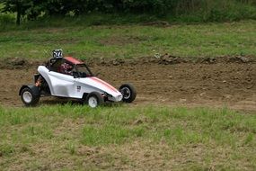 white racing car without top in autocross