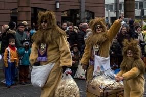 people in lion costumes at the festival