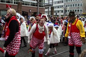 crowd of people in colorful costumes at a carnival