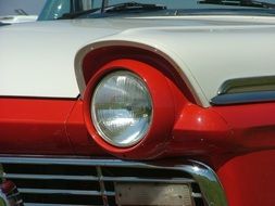 round headlights of a classic sports car