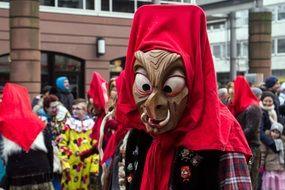 people in masks at the carnival