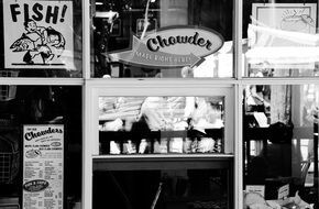 Black and white photo of urban fish chips shop