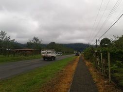 truck moves along the sidewalk