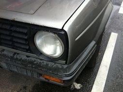 headlight on a gray car