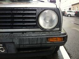 left headlight on a gray car