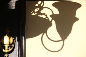 shadow of street lantern on wall