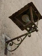 street lamp on the wall of the house