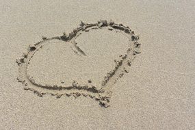 big heart on a sandy beach