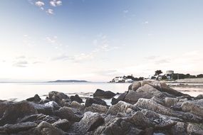 rocks beach of ocean blue sky