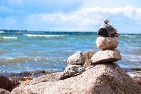 small stone tower on a sunny beach