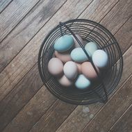 Basket with coloured easter eggs