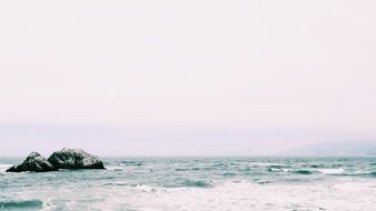 ocean coast water rock sky horizon