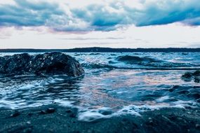 pacific ocean waves under the colorful clouds