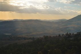 panorama of the valley among the mountains in the sun at dusk