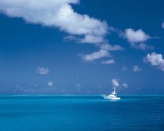 white luxury yacht in the turquoise ocean