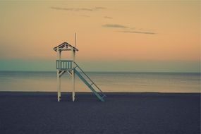 lifeguard tower on the beach of the ocean