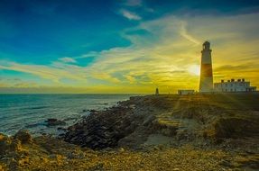 lighthouse on the ocean at sunset, portland bill
