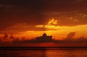 sunset ocean sea orange glow with clouds