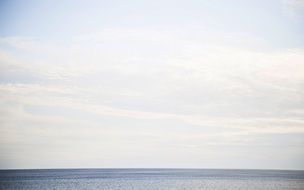 ocean horizon under a cloudy sky