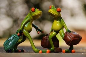 funny frogs with luggage