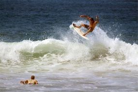 surfer in the foamy spray of the ocean