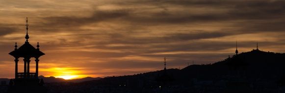 silhouettes of architecture in barcelona at sunset