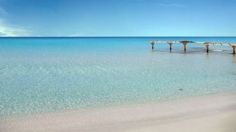 clear blue of an abandoned jetty