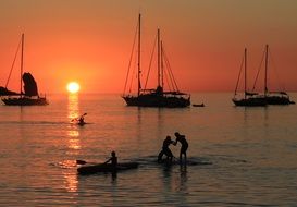 canoeing under the sunset sky