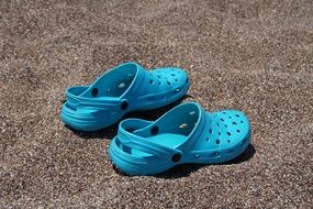 blue crocs on the beach