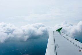 wing plane in clouds