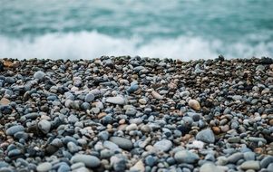 surf on pebbles close up