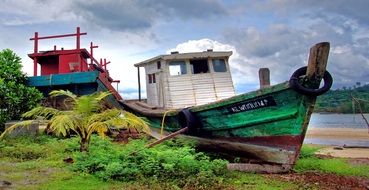 wooden fishing boat on the shore