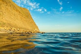 yellow cliff at blue ocean, uk, england, dorset