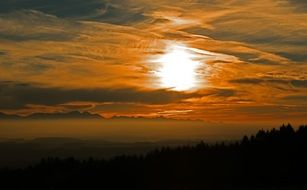 Beautiful and colorful sunset among the clouds on landscape