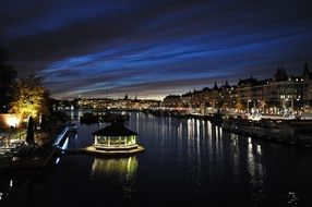 houses on the canal in stockholm at night