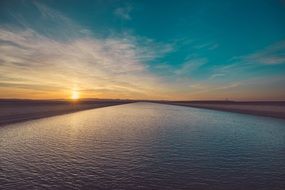 twilight over ripples of a river