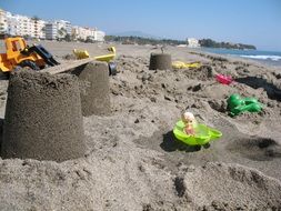 children's toys in the sand on the beach