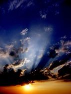 blue sky and golden sun in the evening sky
