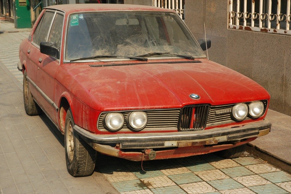 rusty red car BMW