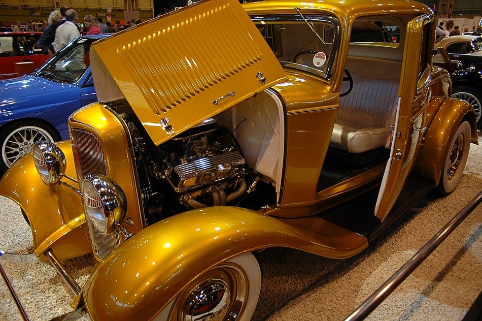 golden retro car on display