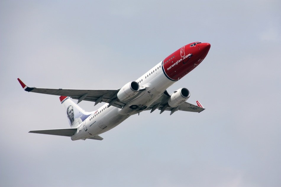airplane with a red cabin in the sky